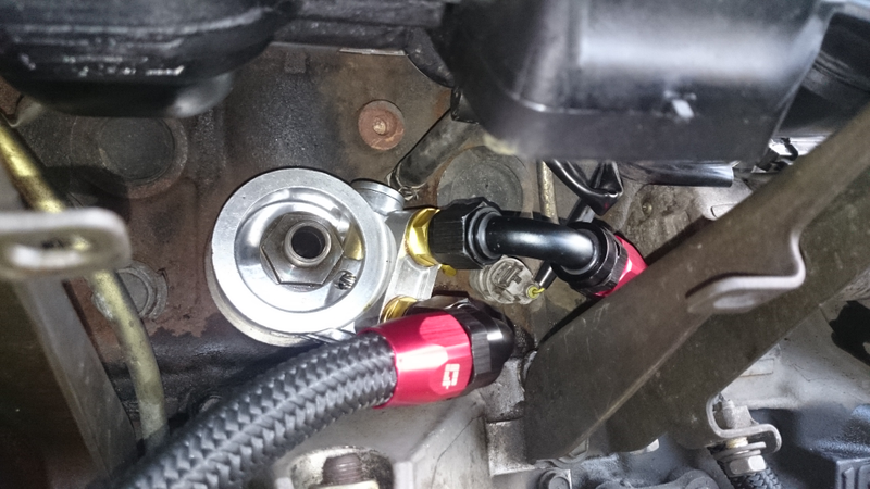 The aforementioned thermostatic sandwich plate. We fitted this now, as it would have been an utter nightmare to do in the car. Took quite a lot of fiddling to get in, including a trip to the local autofactors to get a 1/4" BSP plug to replace an un-needed connector on the block, and allow us to orientate the plate as needed.